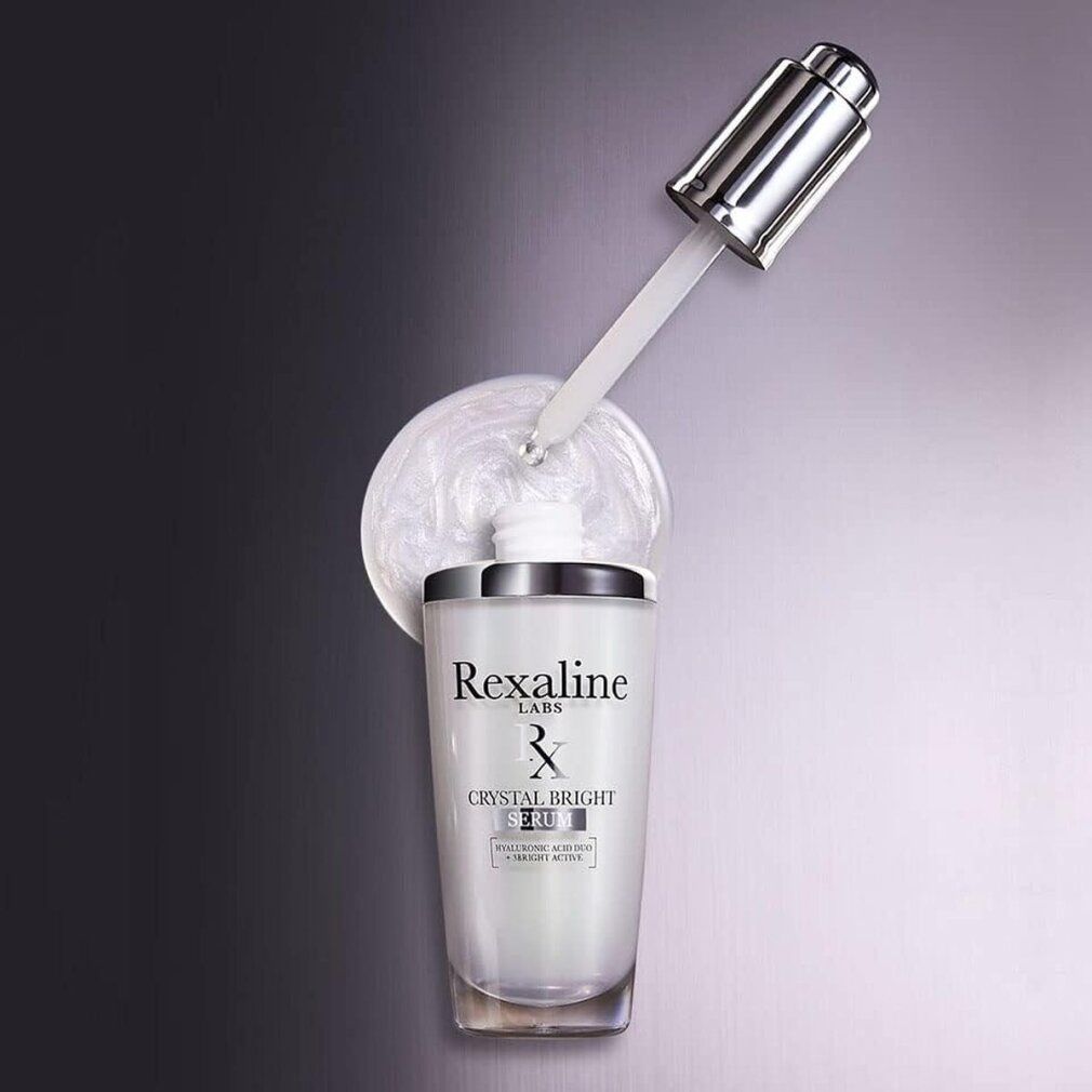 Serumflasche mit Pipette und Serumtropfen. Rexaline-Logo und Crystal Bright Serum-Schriftzug.