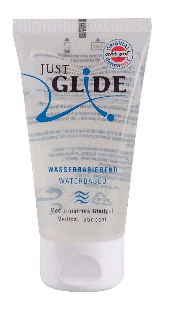 Tube mit weißem Deckel. Aufschrift: JUST GLIDE, Wasserbasiert, Gleitgel/Lubricant. Siegel: Sehr Gut. Blaue Designelemente.