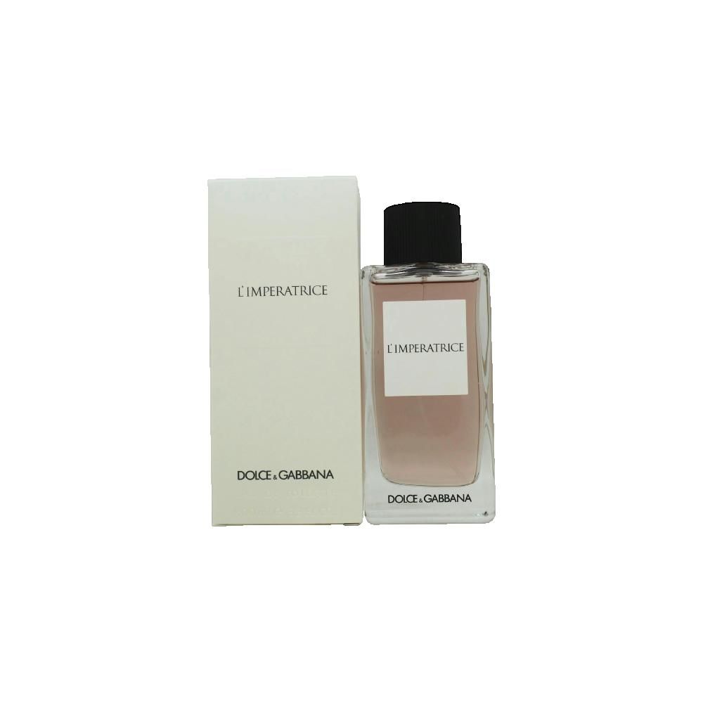 Parfümflasche und Verpackung. Aufschrift: L'IMPERATRICE, DOLCE & GABBANA. Flasche mit schwarzem Verschluss, rosa Flüssigkeit.