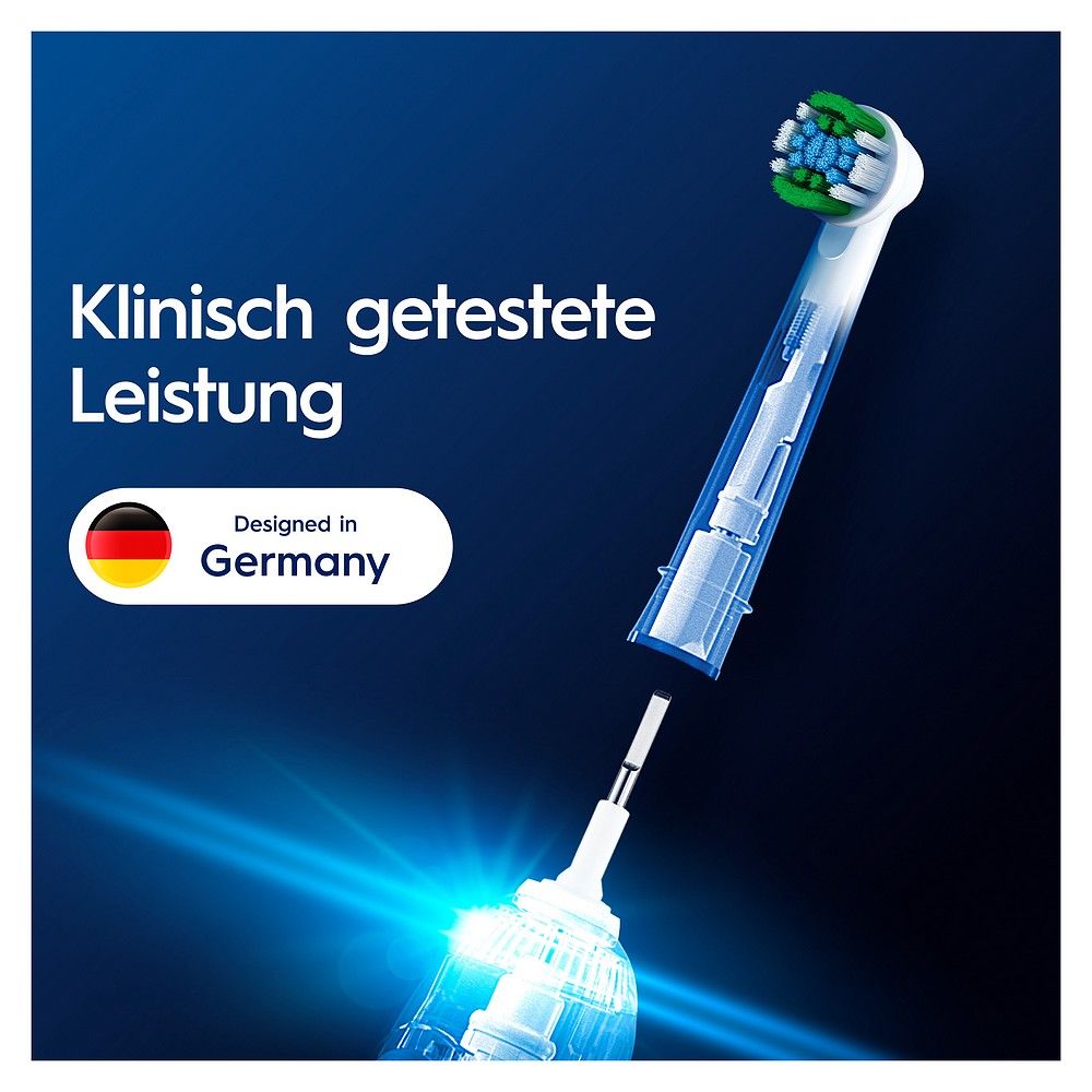 Aufsteckbürste mit transparentem Schaft und grünen/blauen Borsten. "Designed in Germany".
