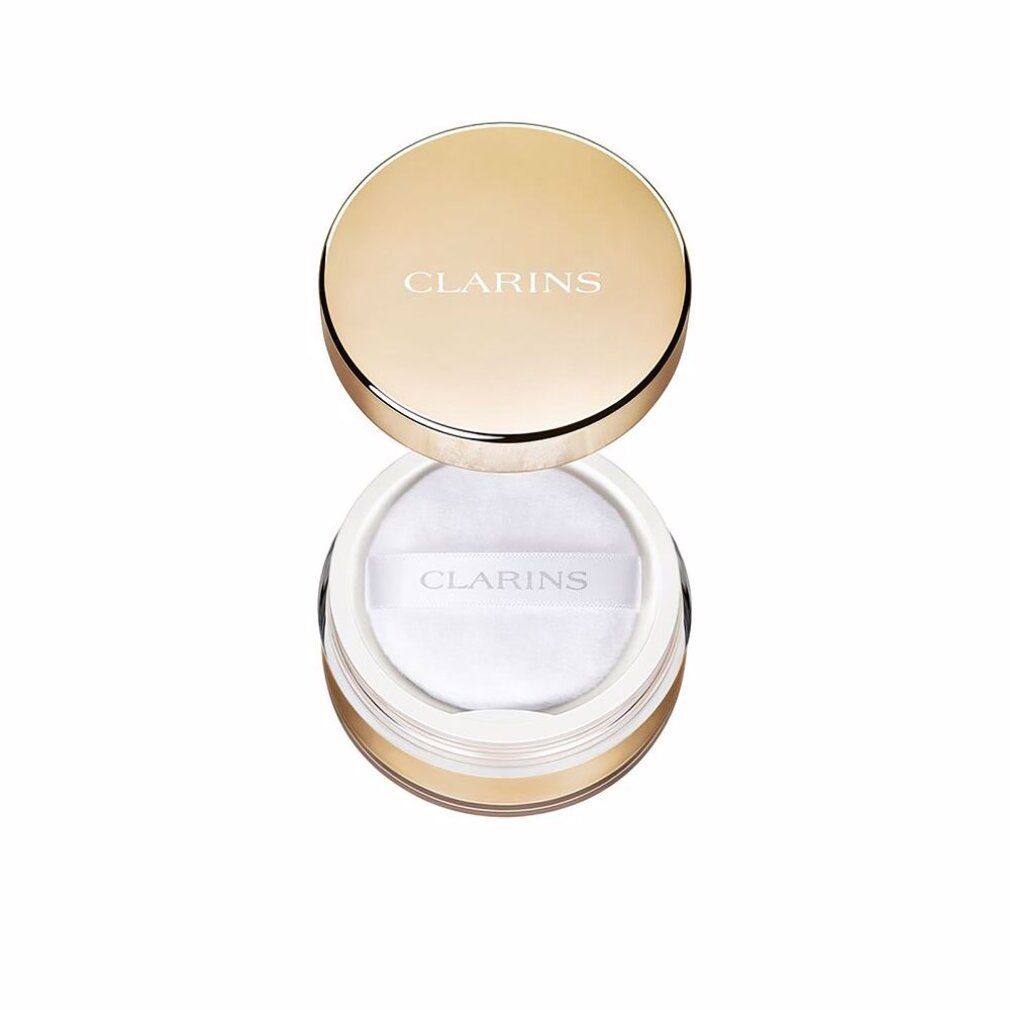 Clarins Puder in goldener Dose mit weißem Puder und Applikator.