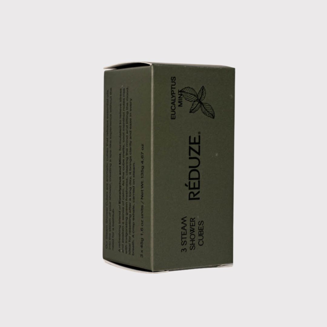 Grüne Schachtel mit Text und Logo. Aufschrift: RÉDUZE, 3 Steam Shower Cubes, Eukalyptus Minze.