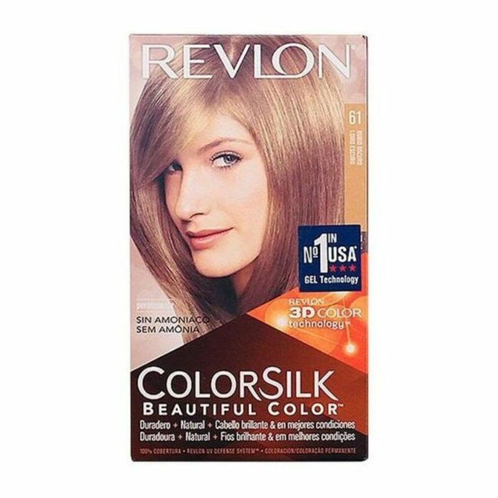 Haarfärbemittel-Verpackung. Revlon Colorsilk, Dark Blonde 61. Abbildung einer Frau mit blondem Haar. Text: 3D Color Technology, ohne Ammoniak.