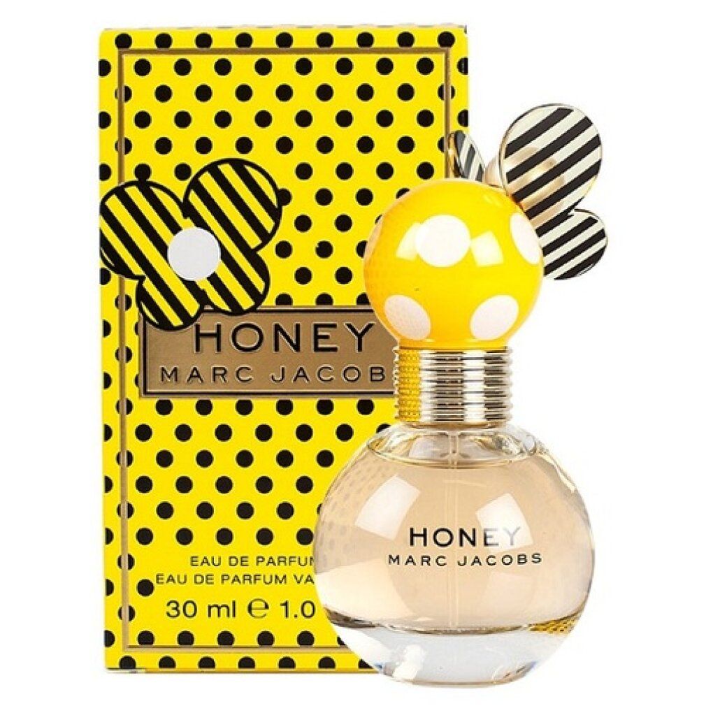 Gelbe Schachtel mit schwarzen Punkten und Flakon. Flakon mit gelbem Körper, weißen Punkten und goldfarbenem Hals. "HONEY" und "MARC JACOBS".