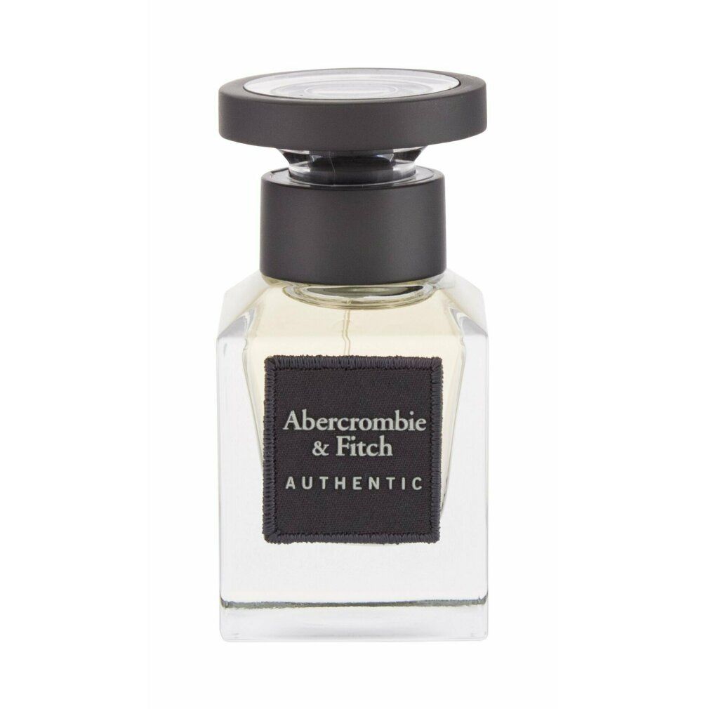 Quadratischer Glasflakon mit schwarzem Verschluss. Schwarzes Etikett mit Aufschrift: Abercrombie & Fitch AUTHENTIC.