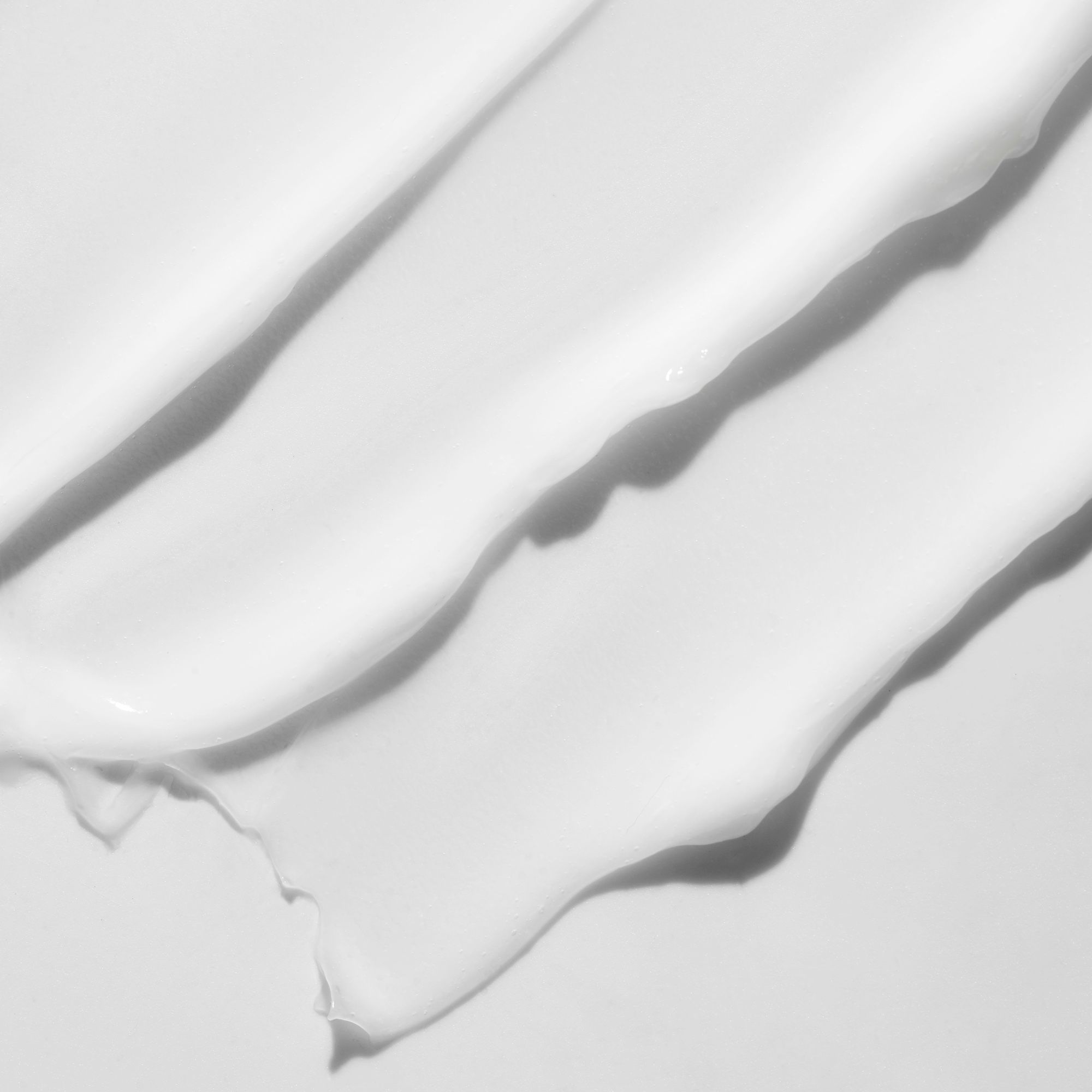 Nahaufnahme von drei cremefarbenen Streifen. Glatte Textur mit Schatten.
