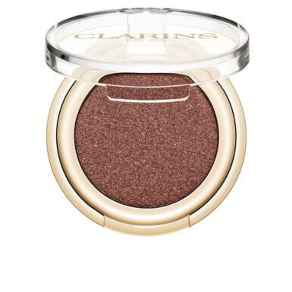 Runder Lidschatten in Goldverpackung, Deckel offen.
