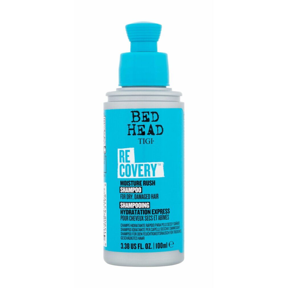 Türkis-farbene Shampoo-Flasche mit blauem Pumpkopf. Bed Head Tigi Recovery Shampoo, Text auf Etikett.