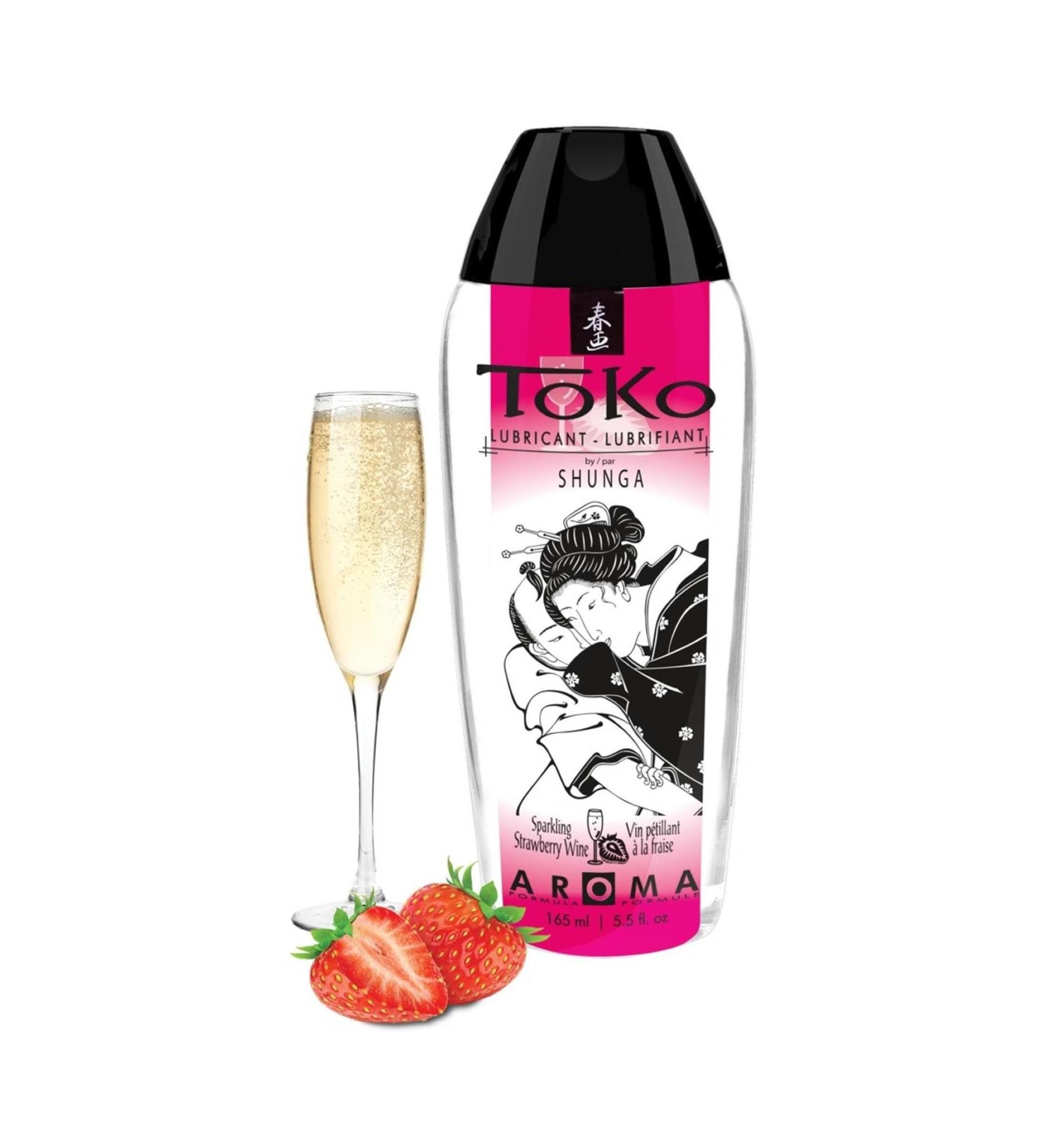 Transparente Flasche mit schwarzem Deckel. "Toko Lubricant", Abbildung einer Frau. Rosa Akzent. Erdbeeren und Sektglas daneben.