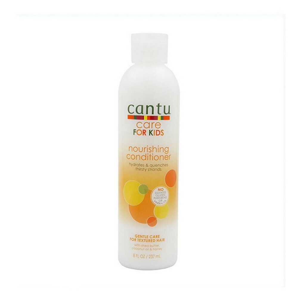 Weiße Flasche Cantu Care For Kids Conditioner. Etikett mit orangefarbenen und gelben Kreisen. Text: Nourishing Conditioner.