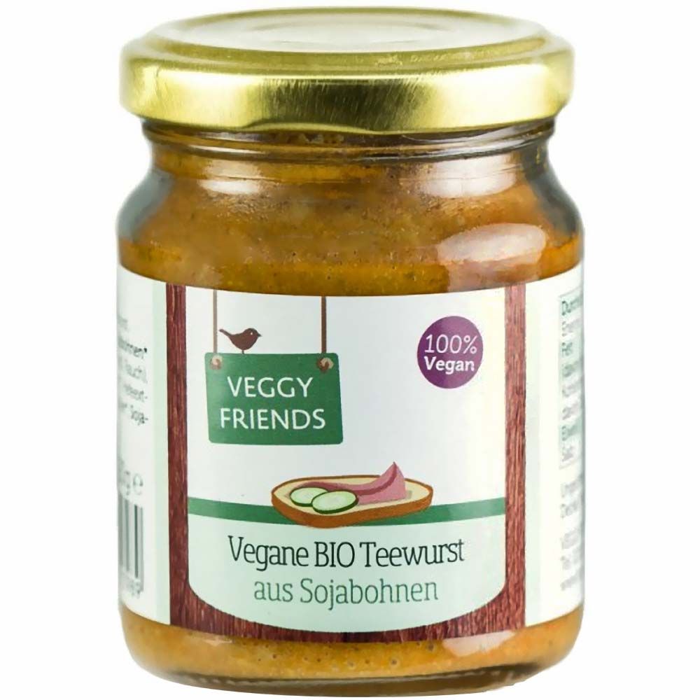 Glas mit Veggy Friends Bio Vegane Teewurst. Etikett mit Logo, Text und 100% Vegan-Siegel. Goldfarbener Deckel.