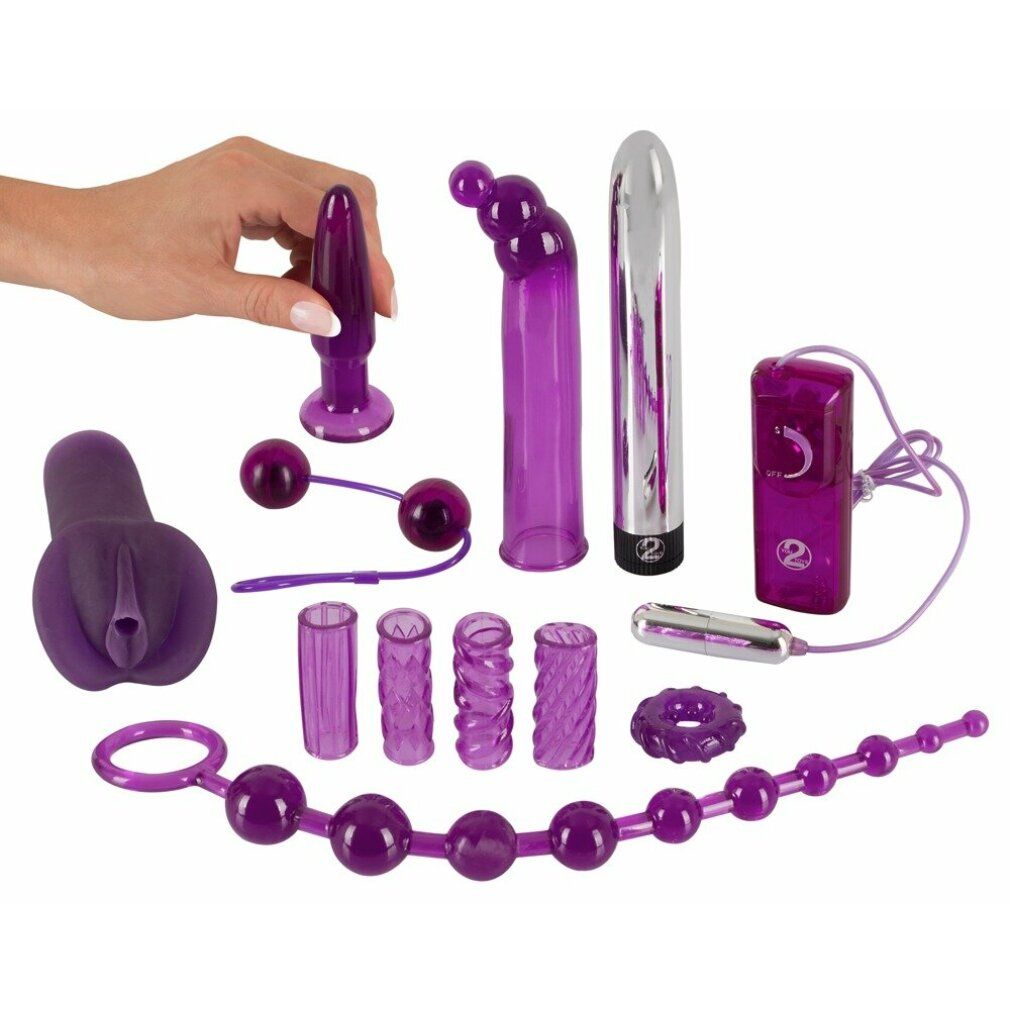 Ein Set violetter Sexspielzeuge, darunter ein Plug, Kugeln und ein Vibrator.