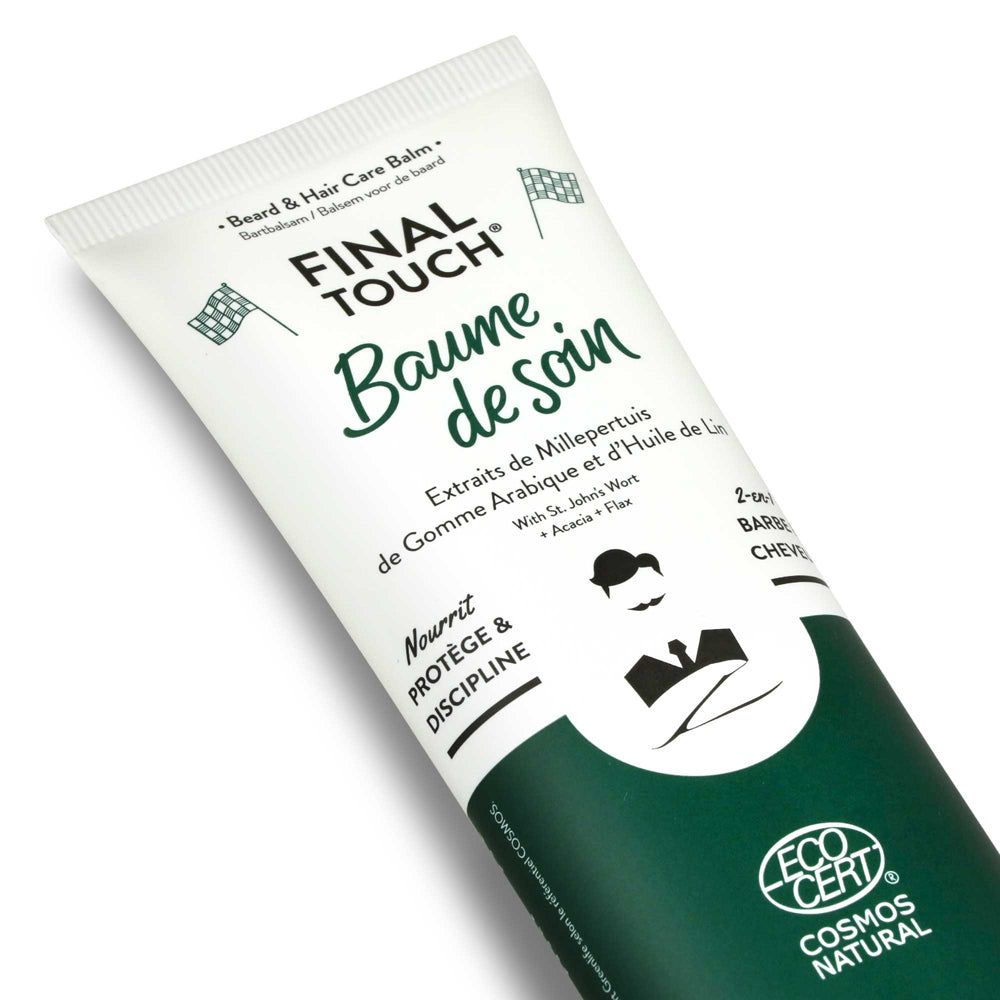 Nahaufnahme einer Tube mit "Baume de soin"-Schriftzug. Grün-weiße Farbgebung. Logo "ECO CERT COSMOS NATURAL".