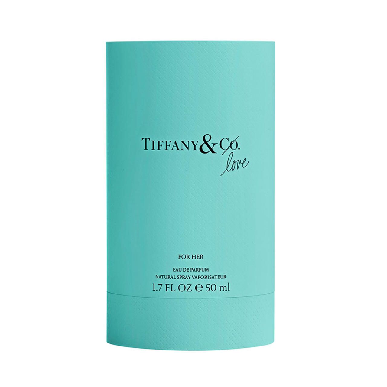 Türkisfarbene zylindrische Verpackung. Aufschrift: Tiffany & Co. Love, For Her, Eau de Parfum Natural Spray Vaporisateur.