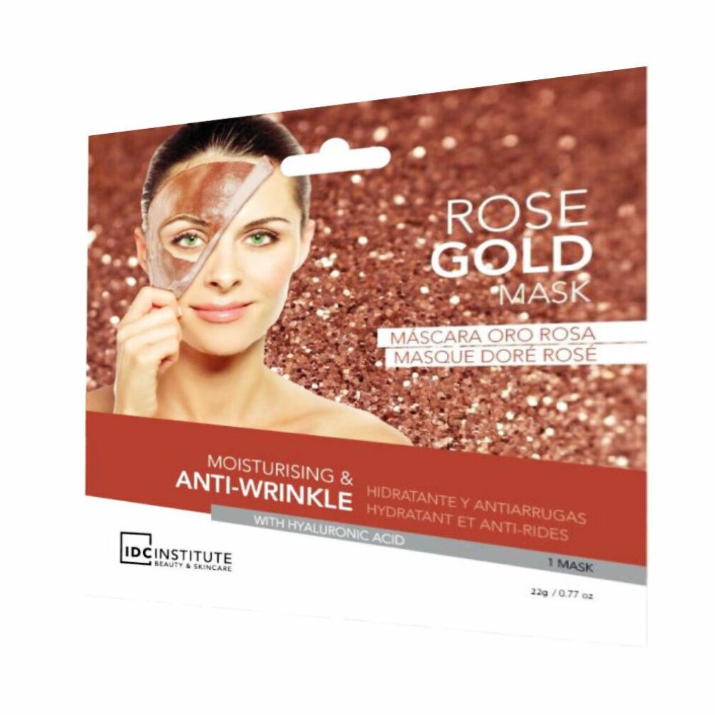 Gesichtsmaske Rose Gold, Anti-Falten-Effekt. Frau mit Maske auf der Hälfte des Gesichts. Verpackung mit Produktnamen und Marke.
