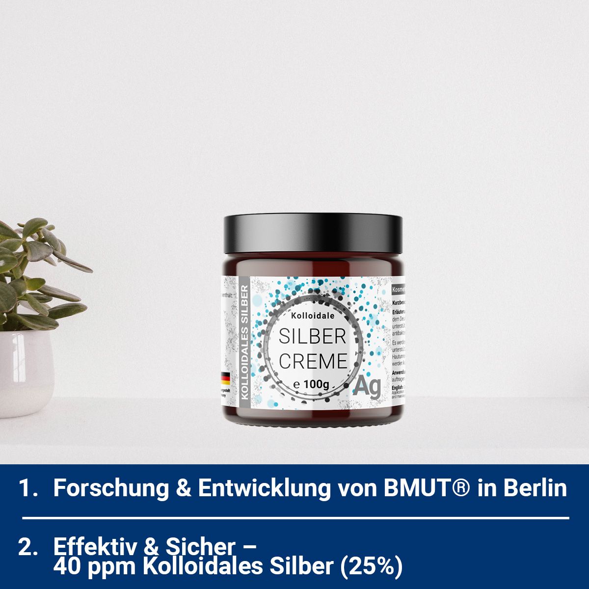 Braunes Glas mit Creme auf weißer Oberfläche. Text: Kolloidale Silber Creme, e 100g, Ag.