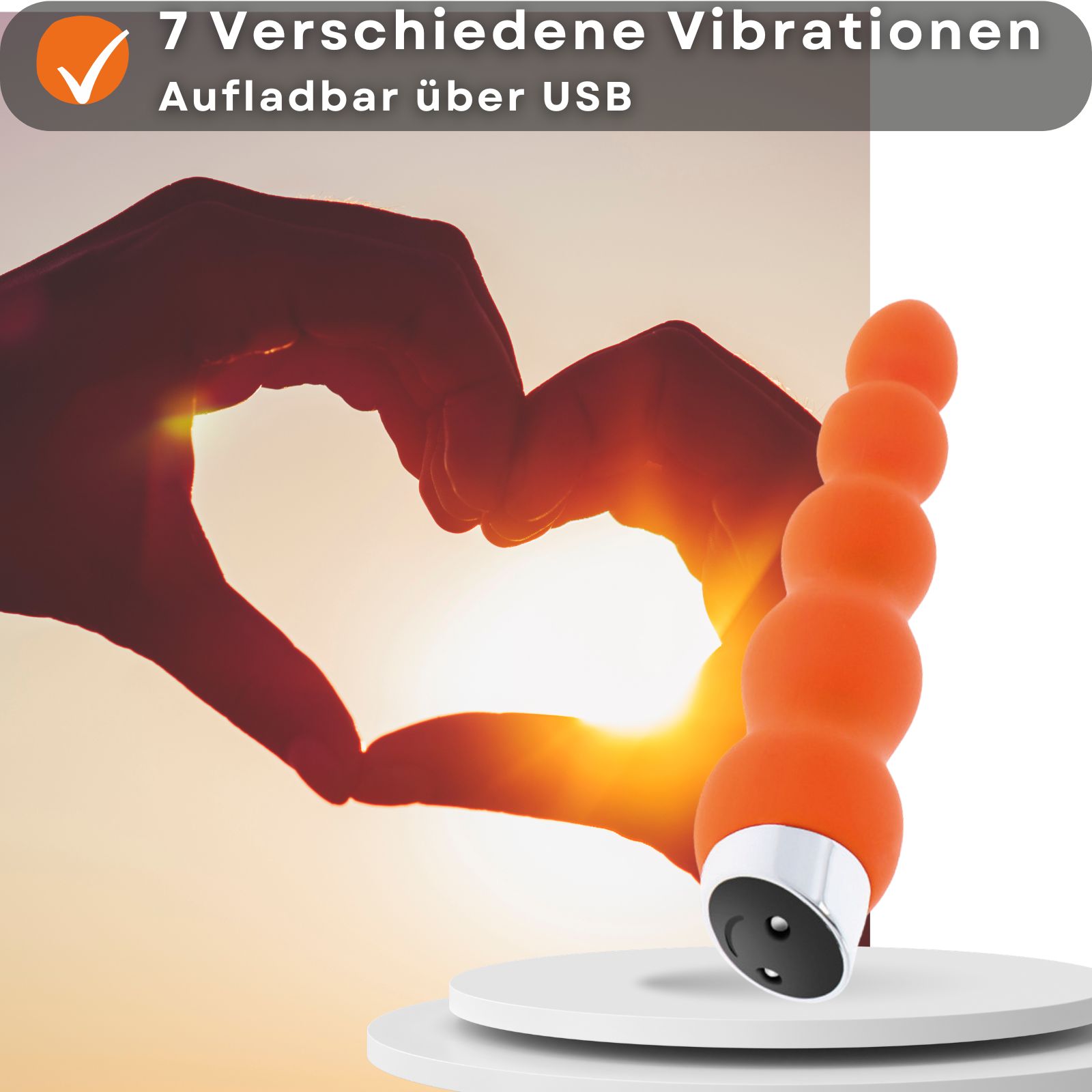 Orangener Vibrator mit Kugeln. Länge 18,5 cm, Durchmesser 3,3 cm. Aus Silikon und ABS-Kunststoff. Wiederaufladbar.