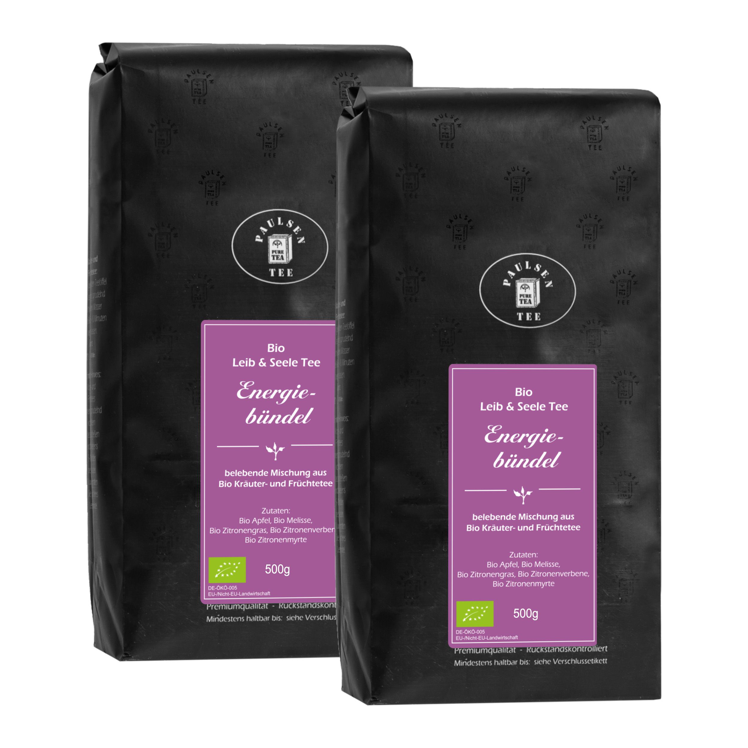 Zwei schwarze Beutel mit lila Etikett. Aufschrift: Paulsen Tee, Bio Energiebündel. Mit Bio-Siegel und 500g.