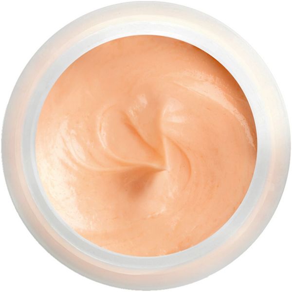 Creme in rundem, weißem Tiegel. Cremefarbene Masse mit sichtbarer Textur. Draufsicht.