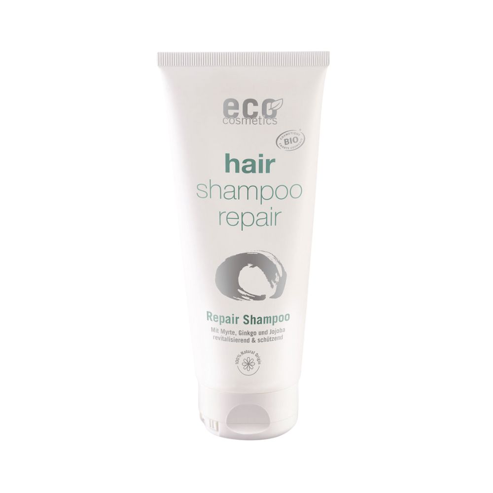 Weiße Tube mit "eco cosmetics" Logo und Schriftzug "hair shampoo repair". Bio-Siegel.