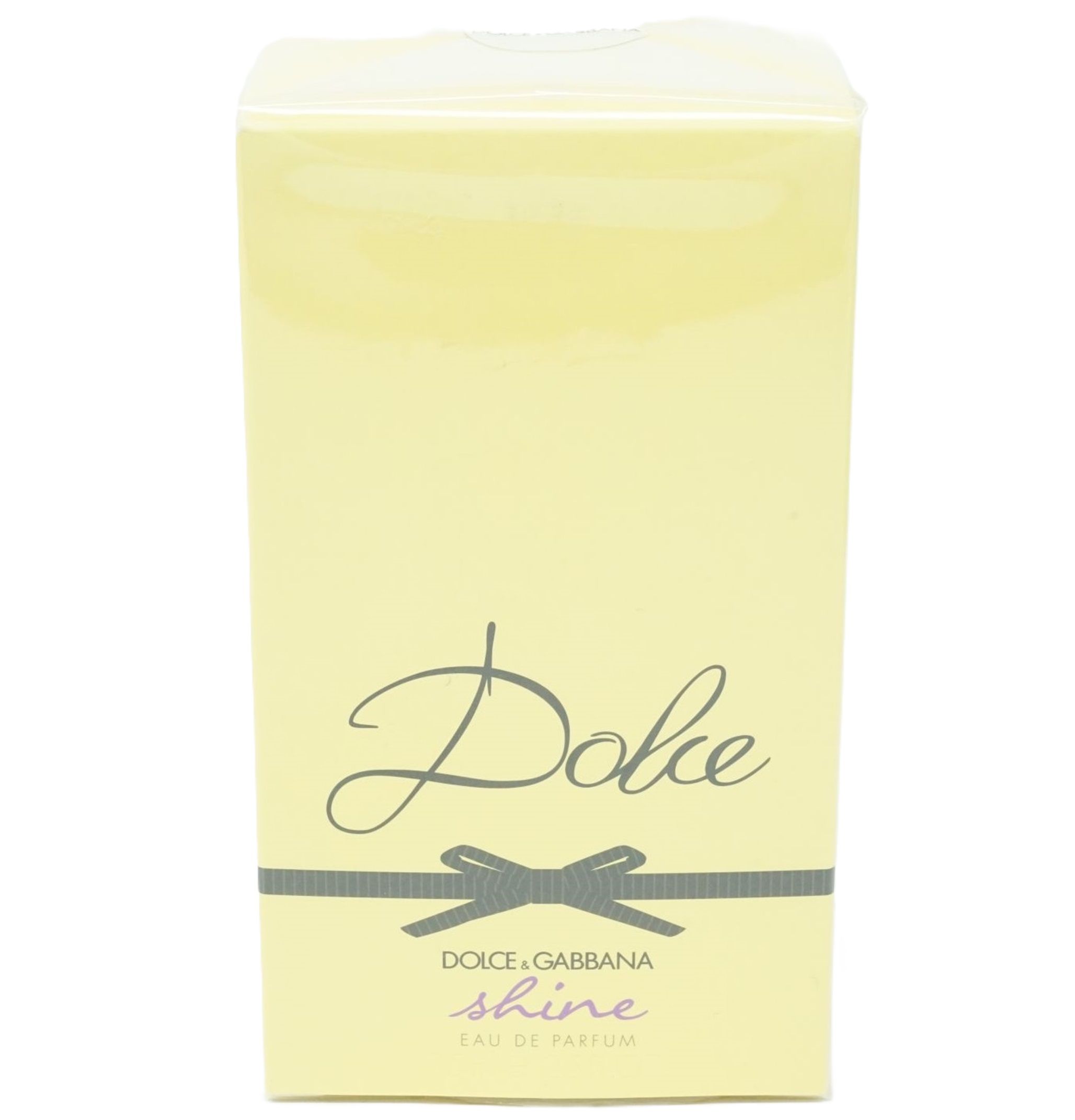 Gelbe Verpackung mit schwarzer Schleife und Aufschrift "Dolce & Gabbana Dolce shine".