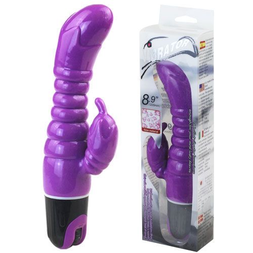 Zwei Ansichten eines lila Vibrators in Verpackung. Transparente Box mit Produktabbildung und Text. Aufschrift: 8.9".