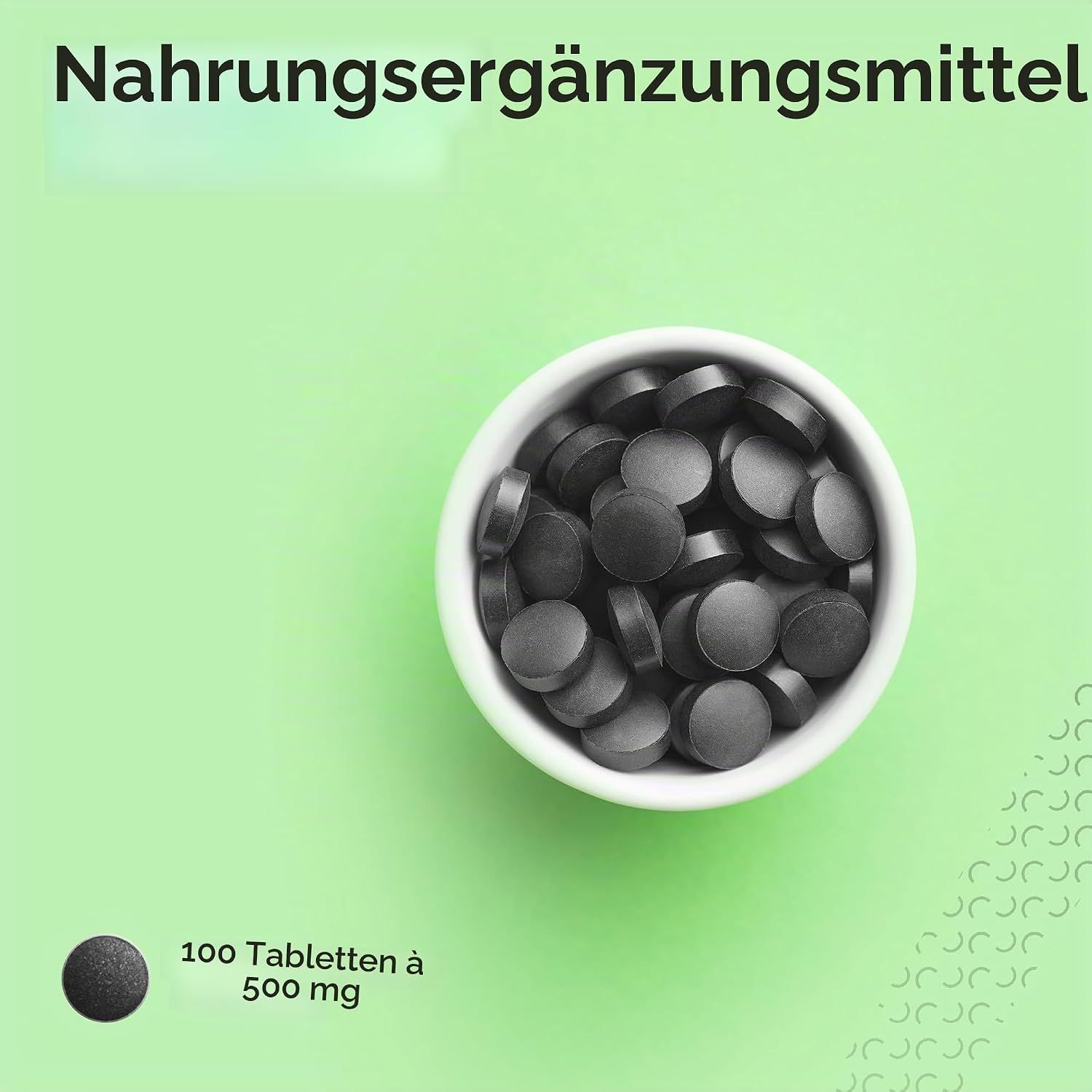 Schwarze Aktivkohle-Tabletten in einer Schale, 100 Tabletten à 500 mg.