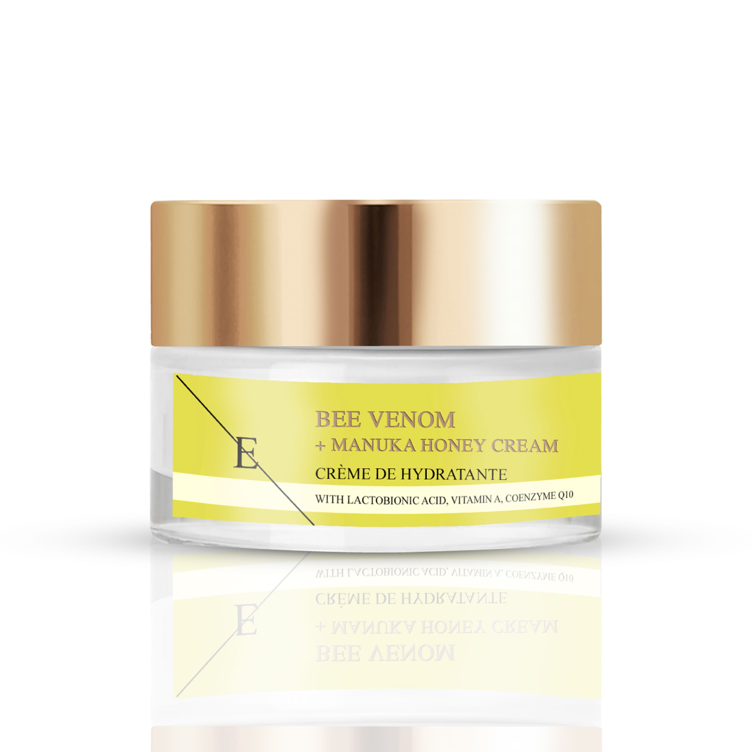 Creme-Glas mit goldenem Deckel. Gelbes Etikett mit Schriftzug: Bee Venom + Manuka Honey Cream. Marke: E.