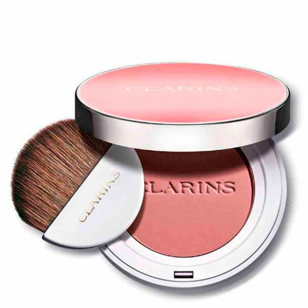 Runder Rouge-Kompaktpuder mit Pinsel. Deckel mit Schriftzug CLARINS. Puder in Rosa. Pinsel mit weißem Griff. Aufschrift CLARINS.