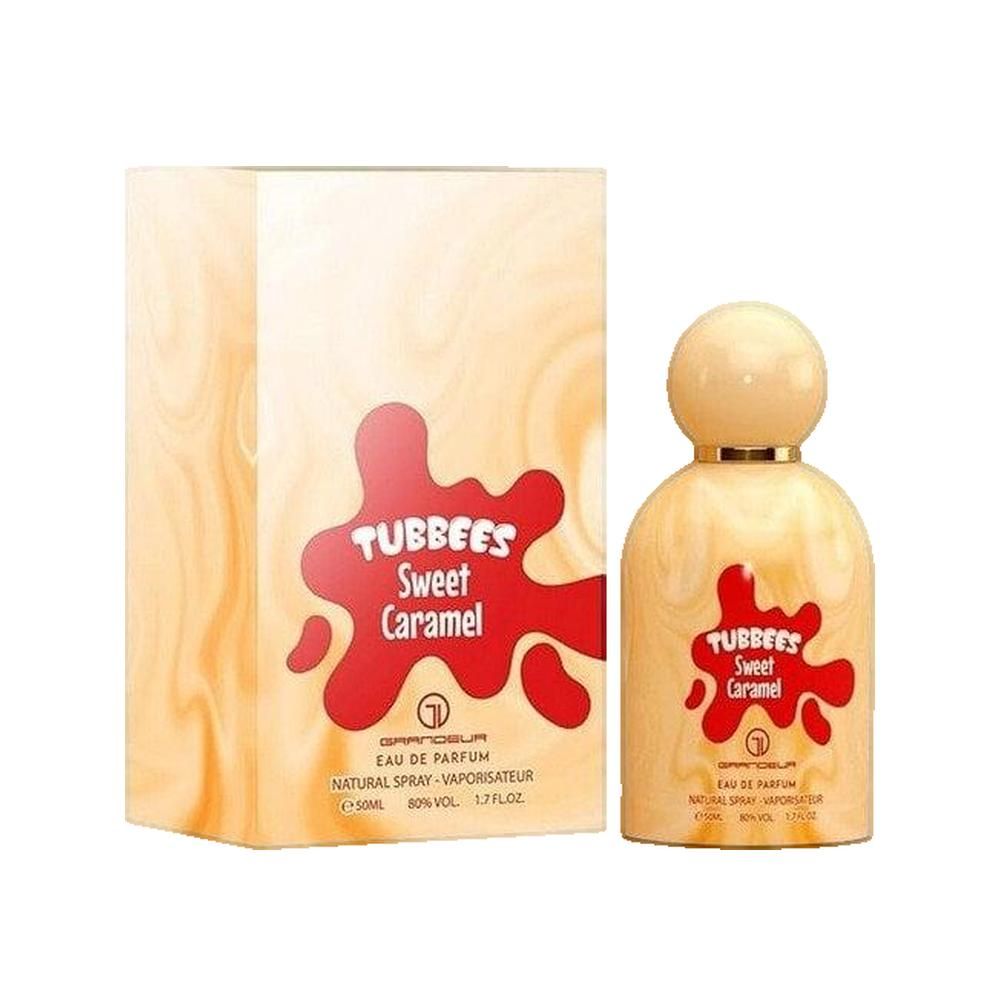 Parfumflasche neben Verpackung. Aufschrift: TUBBEES Sweet Caramel. Verpackung mit marmoriertem Muster.