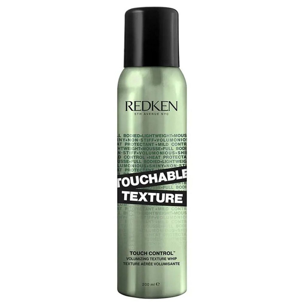 Grüne Sprühflasche mit schwarzem Deckel. Aufschrift: TOUCHABLE TEXTURE, REDKEN. Text: TOUCH CONTROL volumisierende Texturpeitsche.