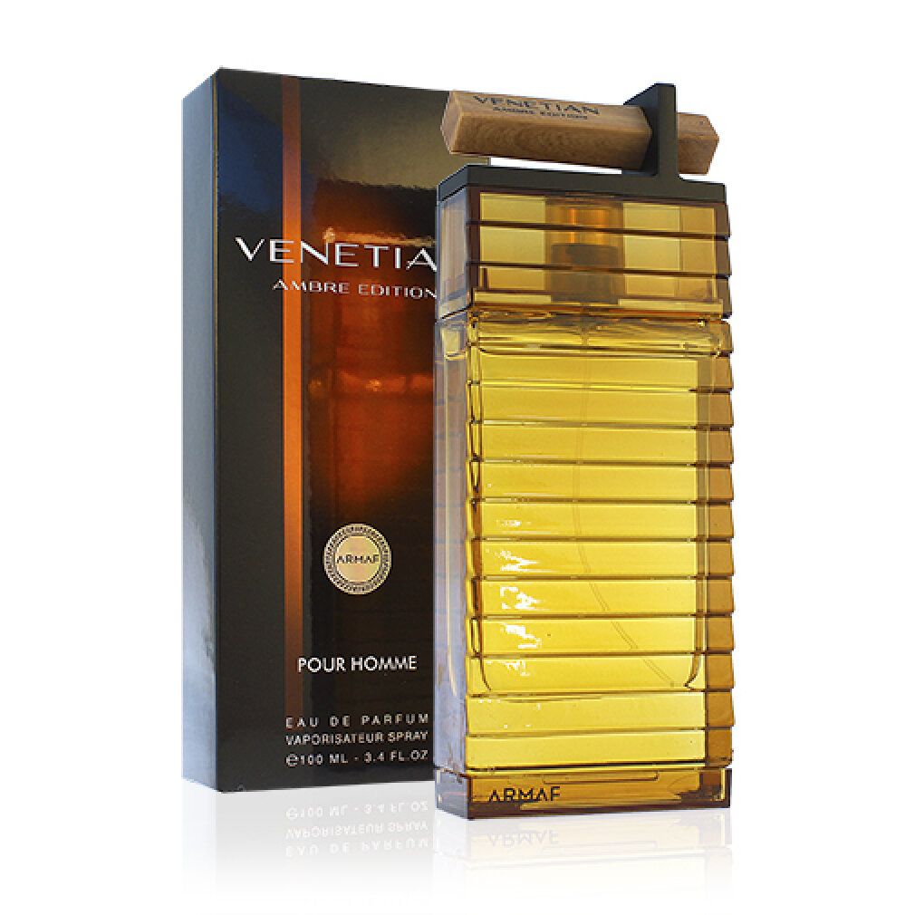 Parfümflakon und Verpackung. Flakon rechteckig, bernsteinfarben, mit Holzaufsatz. Verpackung schwarz mit goldfarbenem Text: Venetian Ambre Edition.