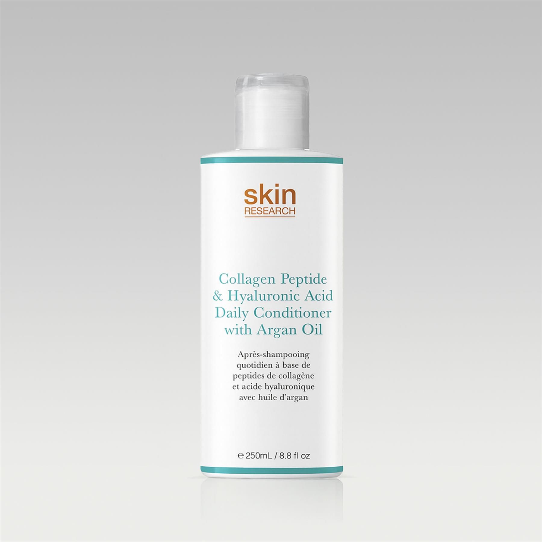 Skin Research Tägliche Pflegespülung mit Kollagenpeptiden, Hyaluronsäure und Arganöl, Flasche auf grauem Hintergrund.