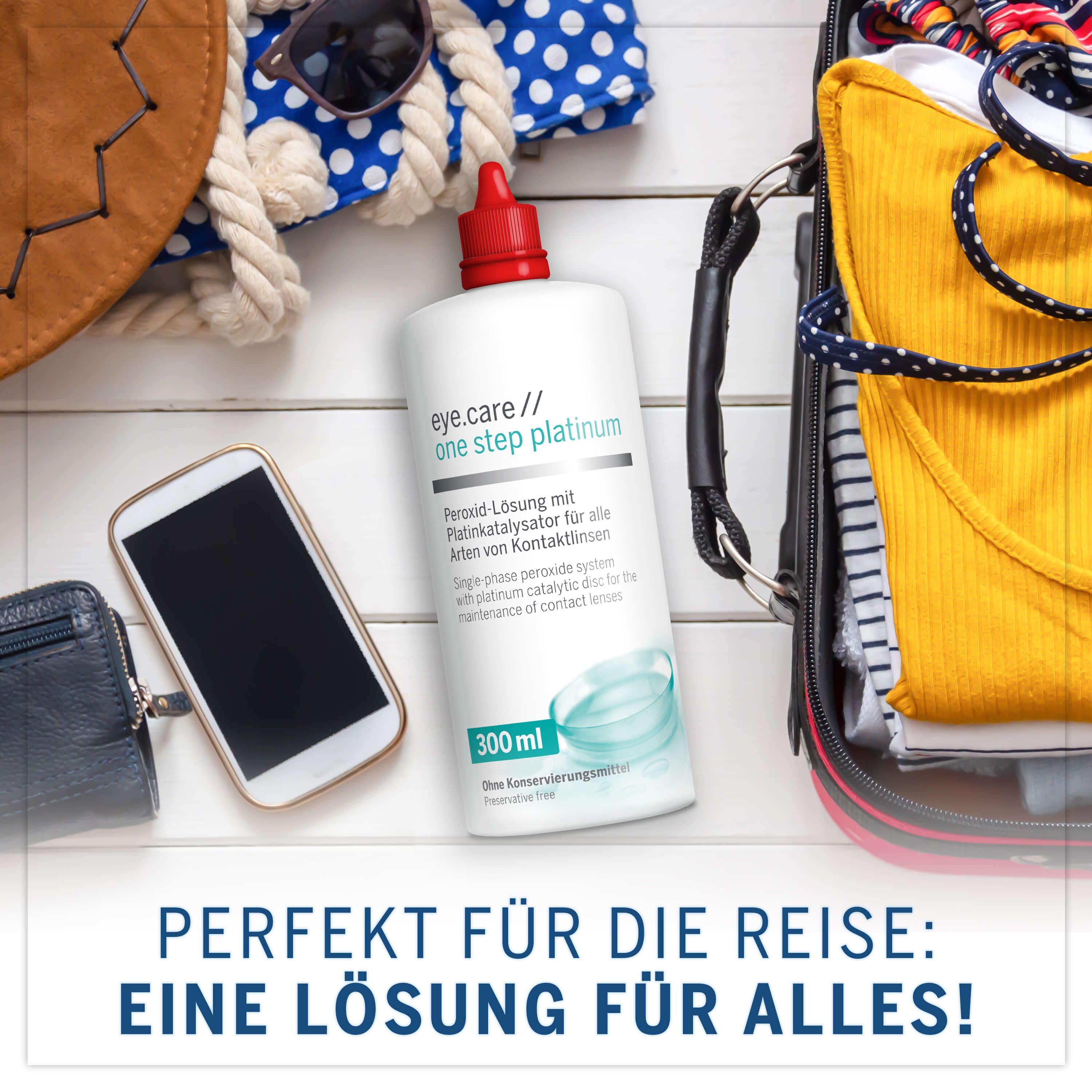 Flasche mit rotem Deckel, Text: eye.care one step platinum, 300 ml. Auf Koffer, Handy, Geldbörse. Perfekt für die Reise.