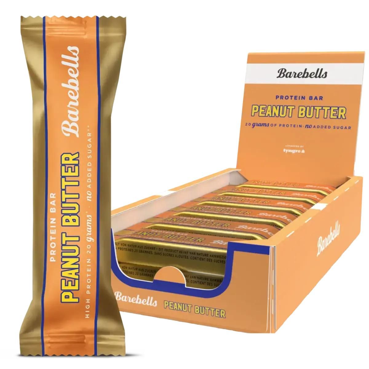Proteinriegel in goldener Verpackung. Aufschrift: Peanut Butter, 20g Protein, No Added Sugar. Geöffnete Box mit Riegeln.