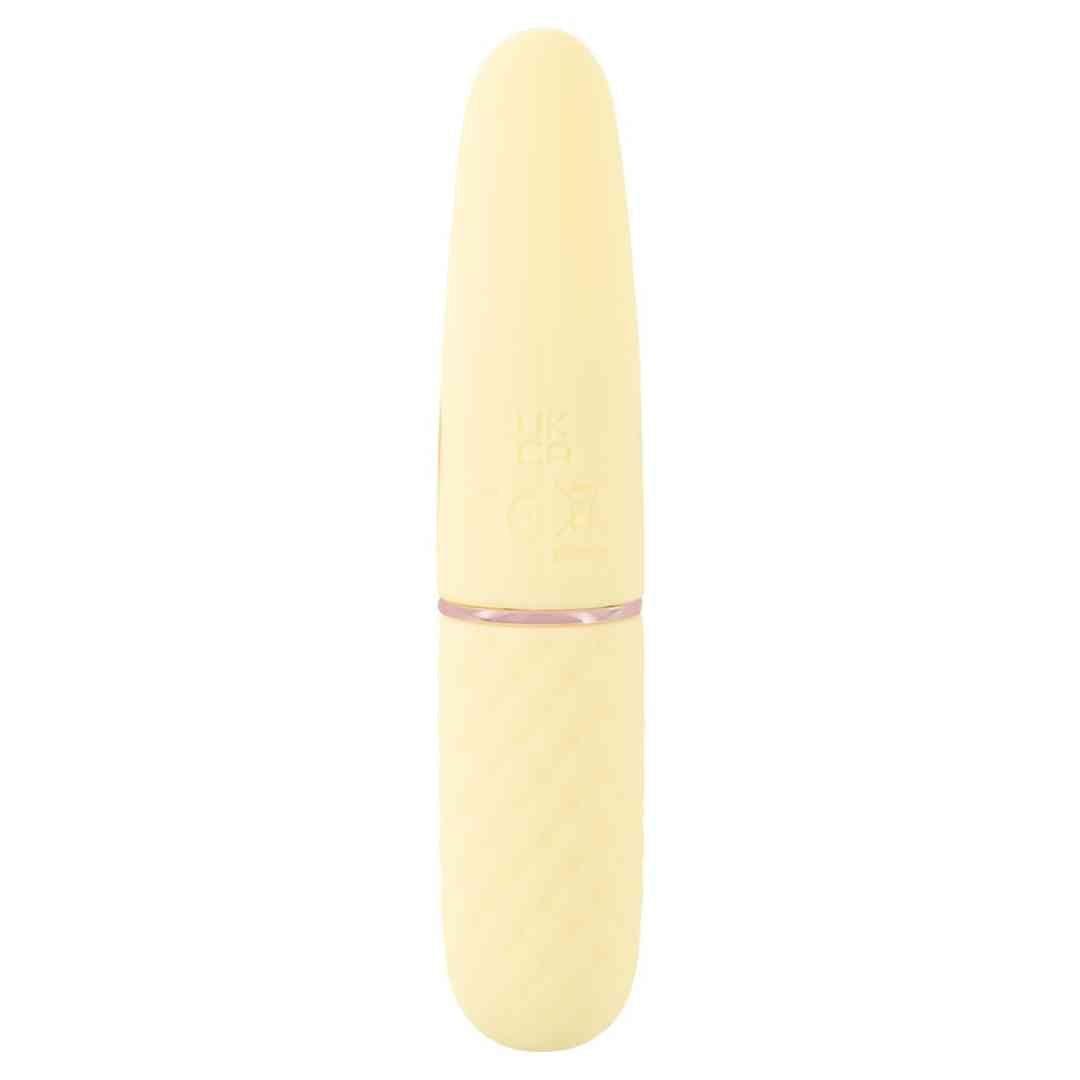 Gelber Vibrator mit abgerundeter Spitze und strukturiertem Griff. Goldfarbener Ring.