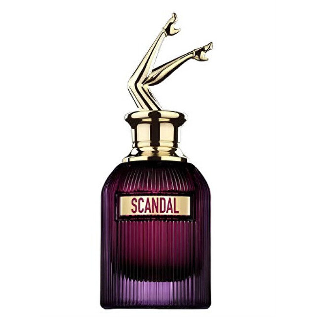 Flakon mit goldfarbenem Deckel in Form von Beinen. Aufschrift "SCANDAL" auf einem rechteckigen Schild. Violettes Glas.
