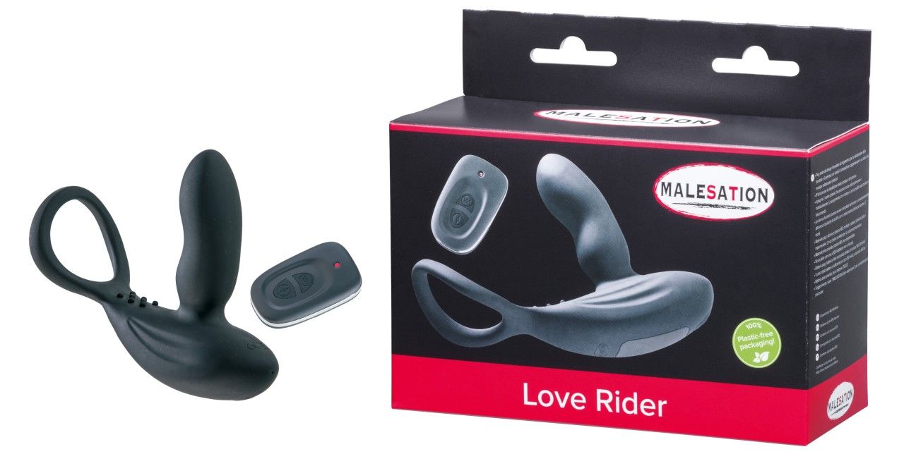 Wellness-Produkt und Fernbedienung neben Produktverpackung. Verpackung zeigt Produktabbildung und Text: MALESATION Love Rider.