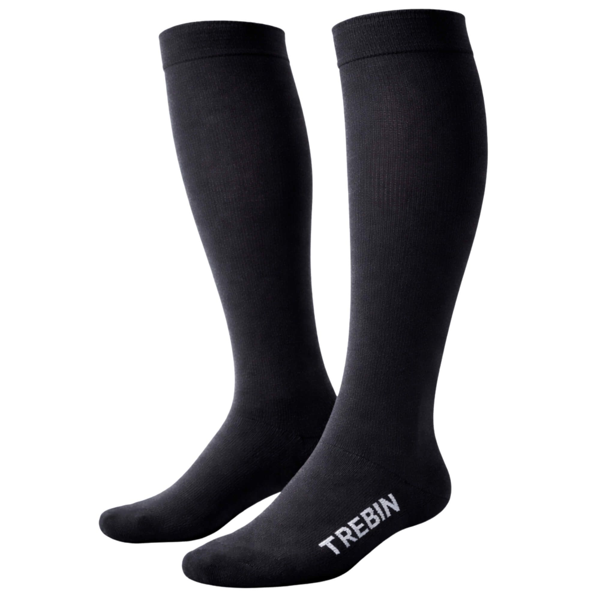 Paar schwarze Kompressionsstrümpfe mit dem Markennamen 'TREBIN'.