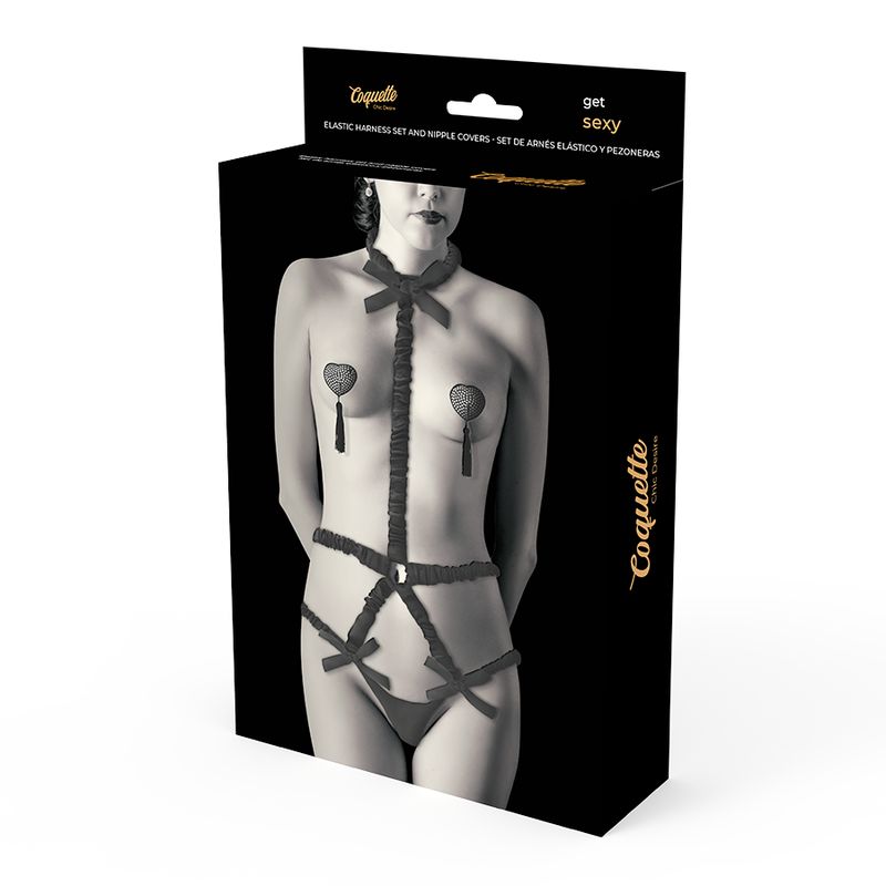 Dessous-Set mit Deluxe-Nippelabdeckungen in Verpackung. Schwarzes Set mit Schleifen und Herz-Nippelabdeckungen. Produktname sichtbar.