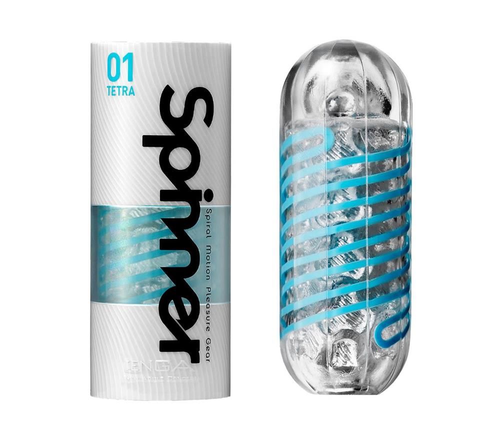 Zylindrische Verpackung und transparentes, längliches Produkt mit blauem Spiralmuster. Text: Spinner.