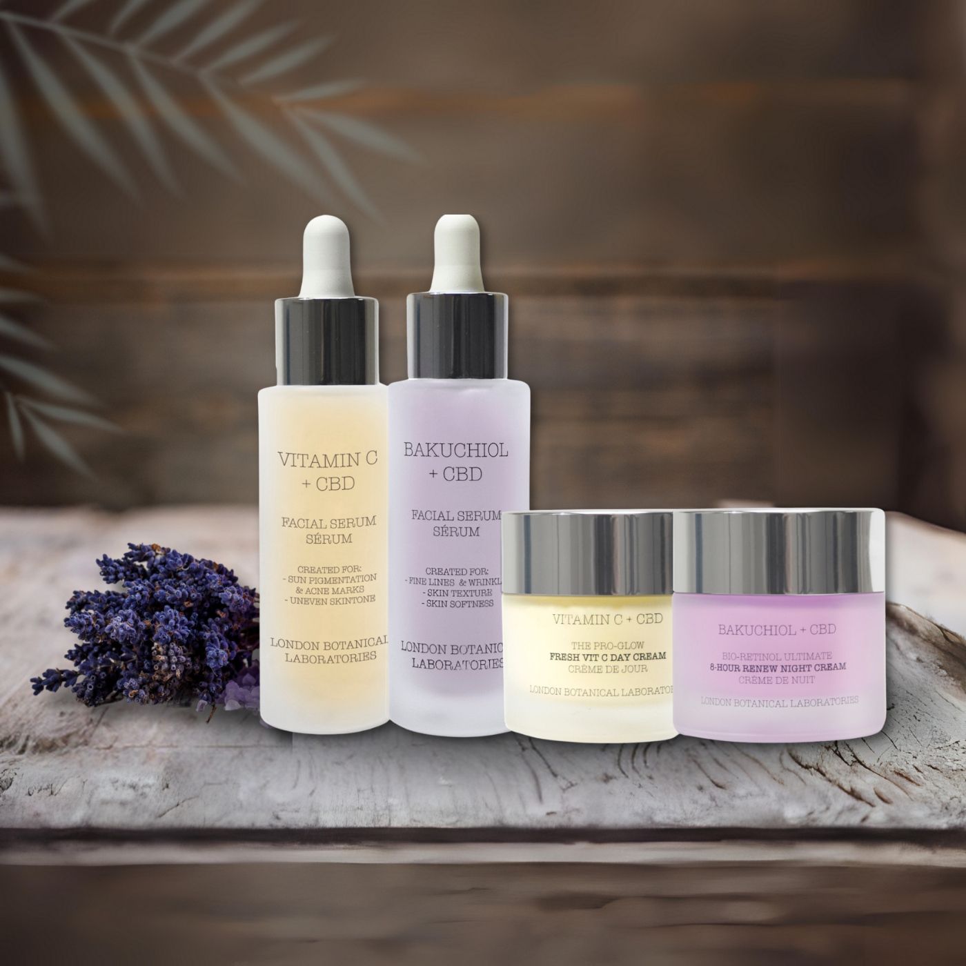 Gesichtspflege-Set mit zwei Serumflaschen und zwei Cremetiegeln. Aufschrift: Vitamin C + CBD, Bakuchiol + CBD, Tag & Nacht Creme. Lavendel.