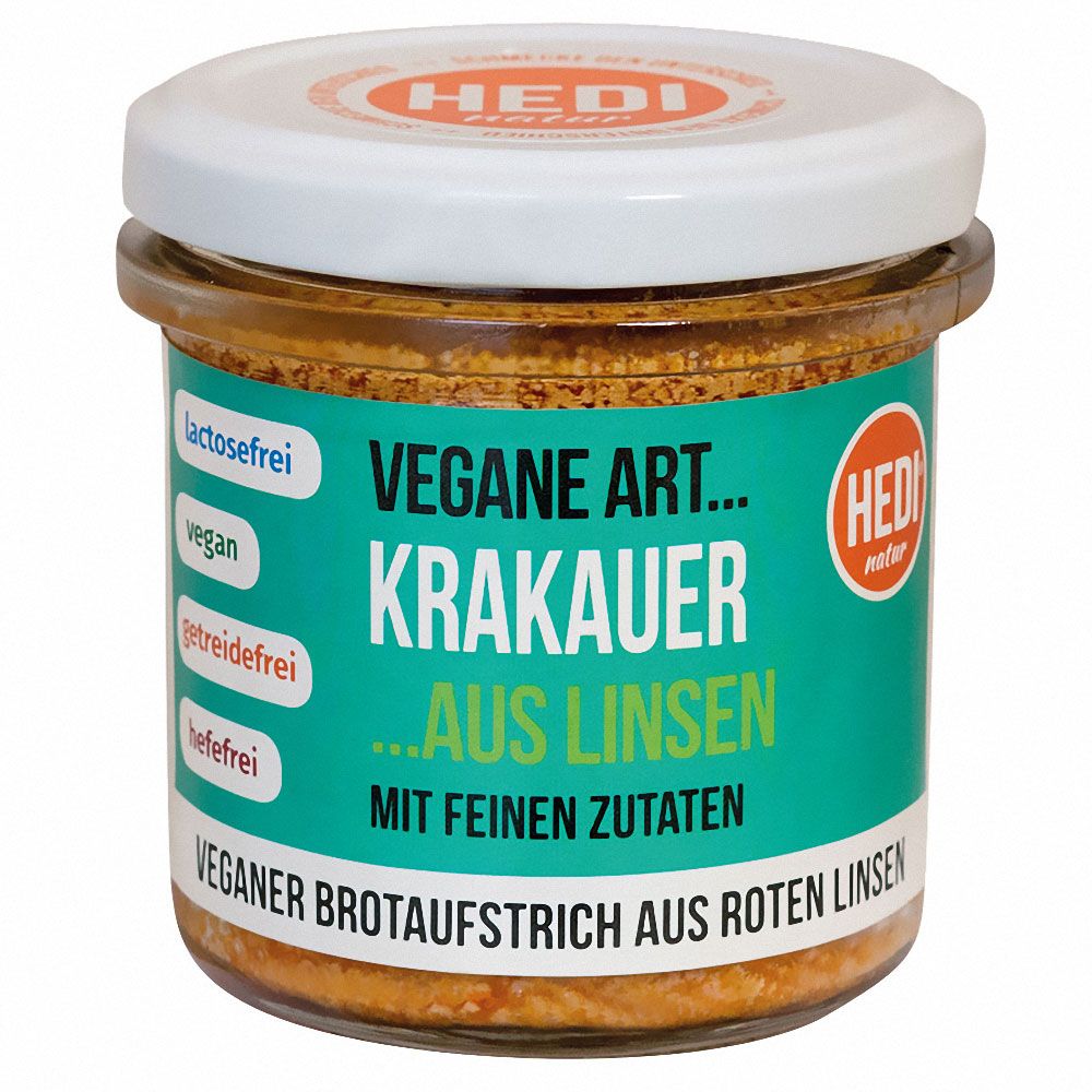 Glas mit veganem Brotaufstrich. Aufschrift: Vegane Art Krakauer aus Linsen. Label mit HEDI-Logo und Angaben zu Inhaltsstoffen.