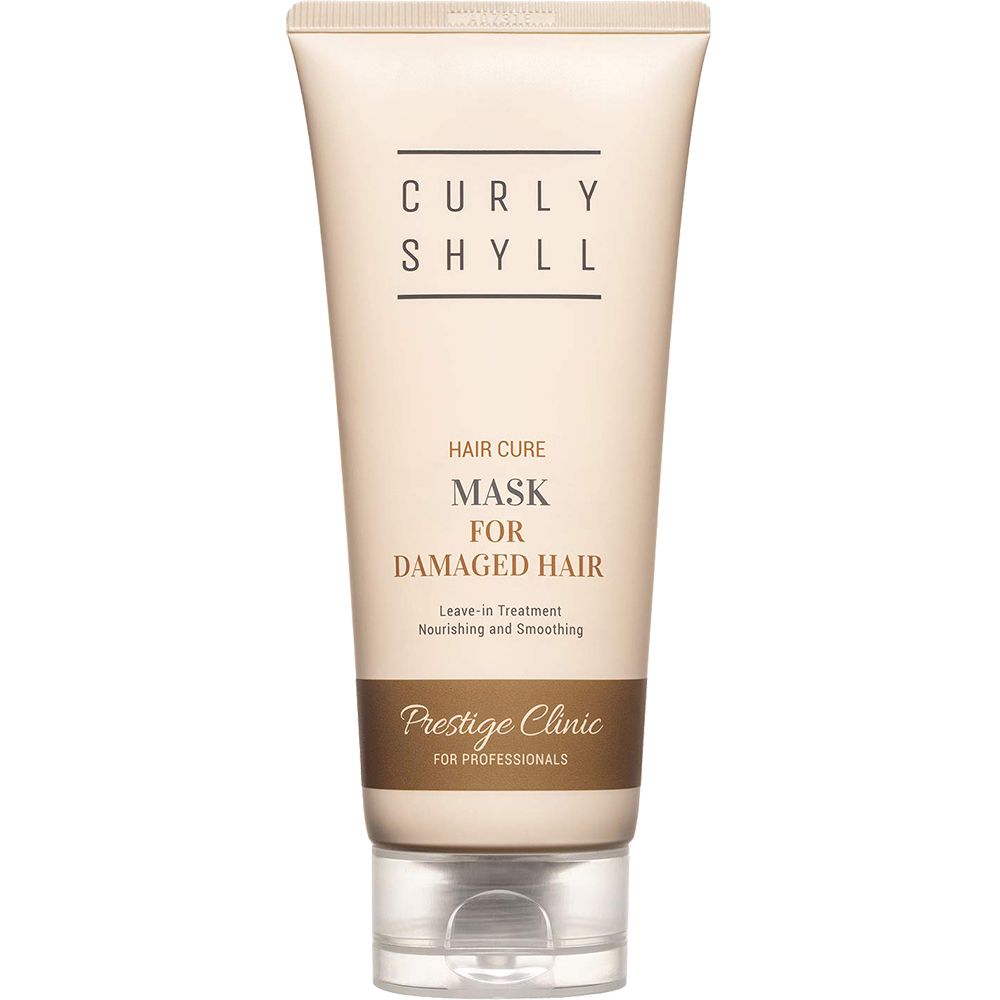 Beige Tube mit Produktnamen CURLY SHYLL, Text: Hair Cure Mask for Damaged Hair. Leave-in Treatment. Prestige Clinic.
