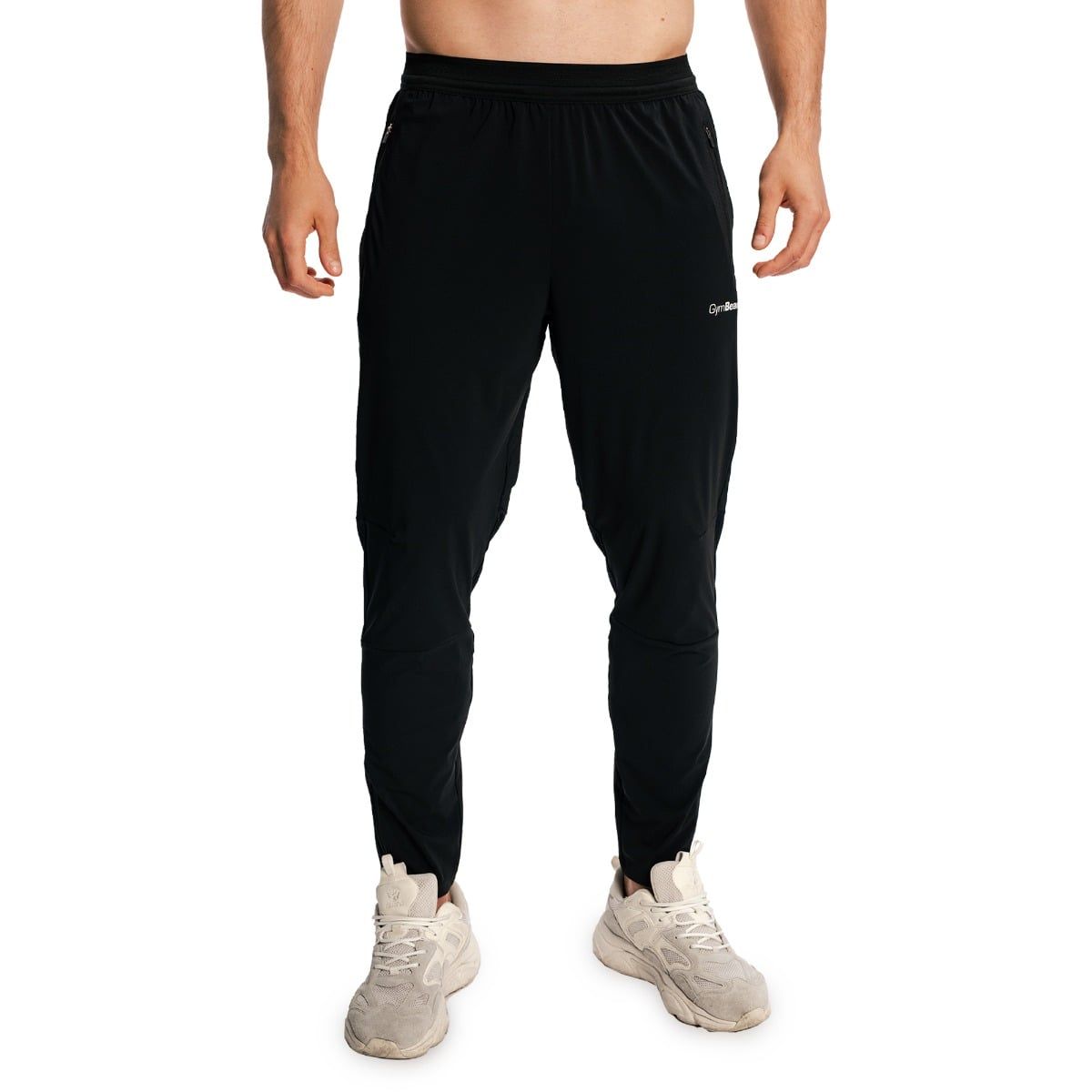 Schwarze Herren-Jogginghose mit Gummizug und Reißverschlusstaschen.