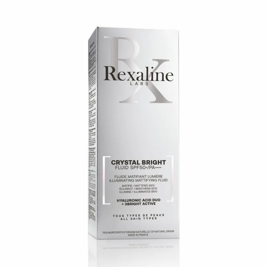 Weiße Verpackung mit Aufschrift: Rexaline Labs, Crystal Bright Fluid SPF50+/PA+++. Für alle Hauttypen. Enthält Hyaluronsäure Duo + Bright Active.