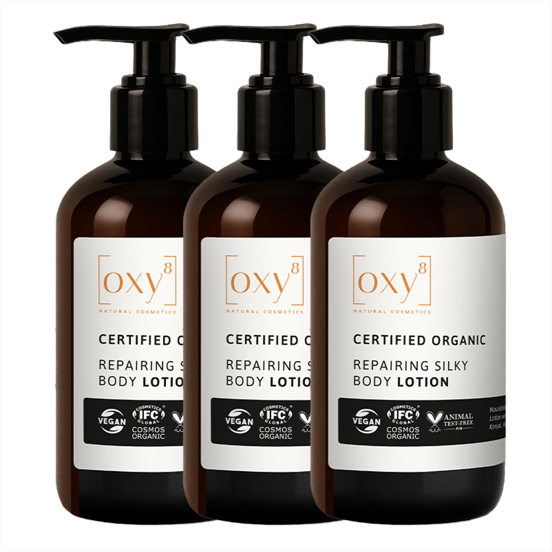 Drei Flaschen Repairing Silky Body Lotion mit Pumpverschluss. Aufschrift: Certified Organic, Vegan, Cosmos Organic.
