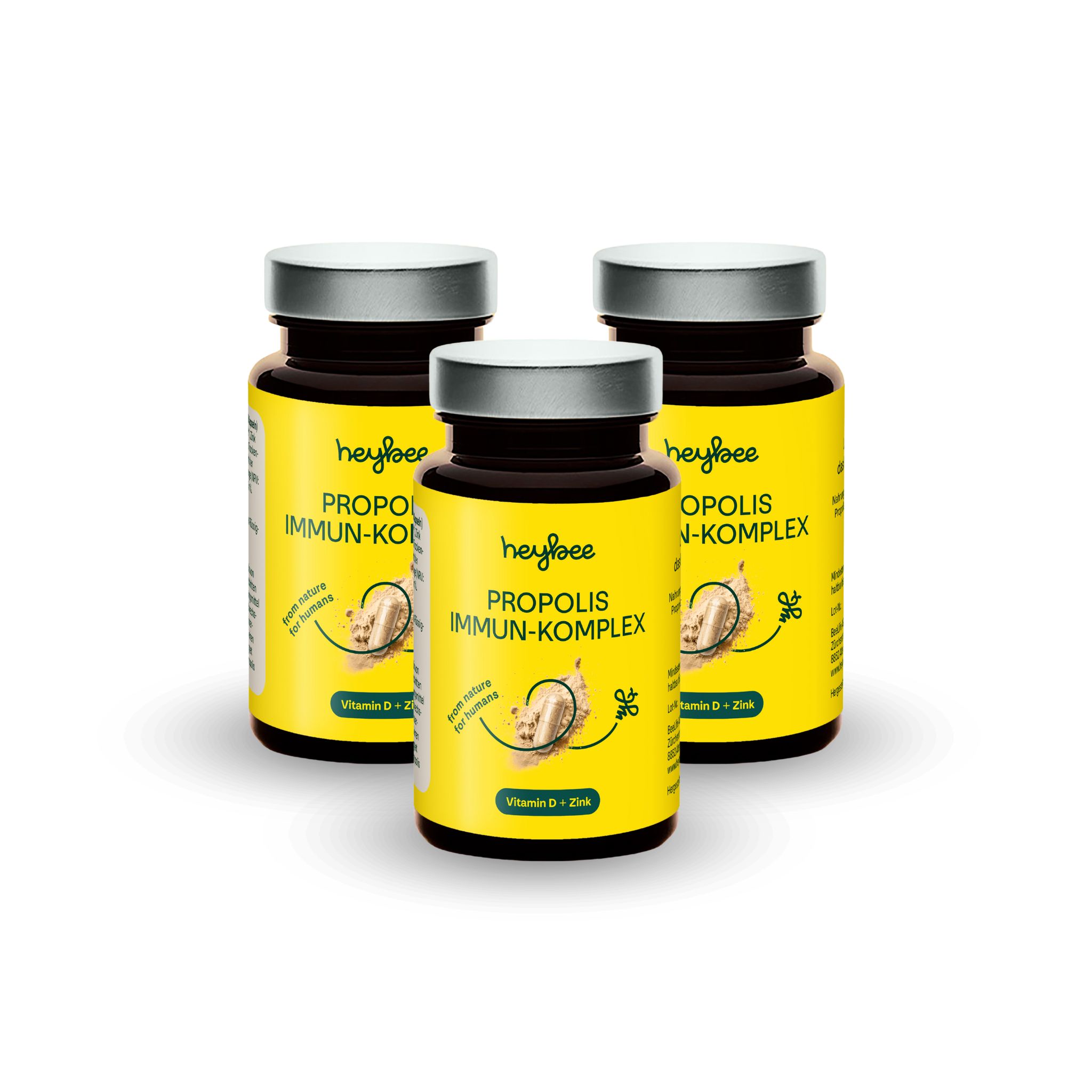 Drei Flaschen Heybee Propolis Immun-Komplex Kapseln. Gelbe Etiketten. Enthält Vitamin D + Zink. Auf weißem Hintergrund.