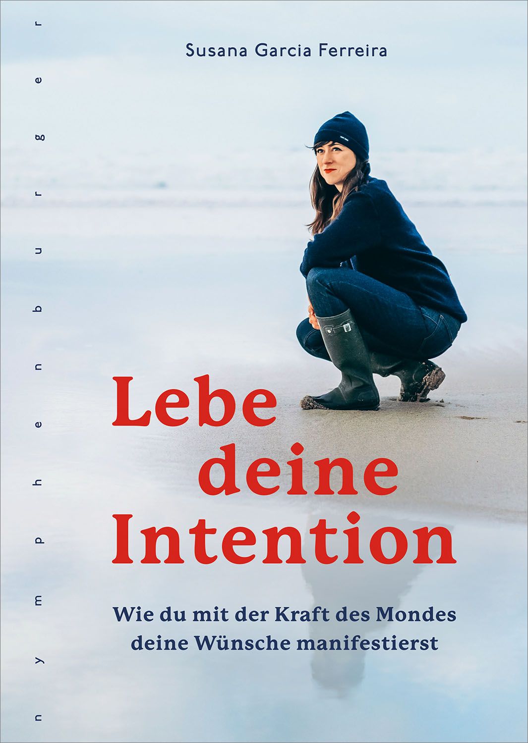 Buchcover mit Titel "Lebe deine Intention". Autorin Susana Garcia Ferreira. Frau am Strand. Roter Titel, blauer Hintergrund.