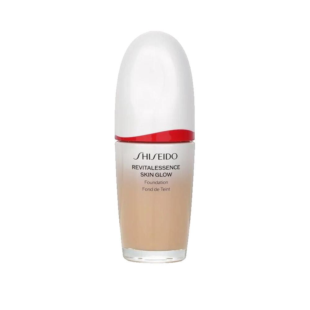 Foundation-Flakon mit weißem Deckel und rotem Akzent. Aufschrift: Shiseido Revitalessence Skin Glow Foundation.